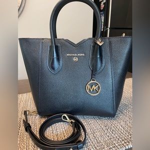 Michael Kors bucket purse with attachable strap.
